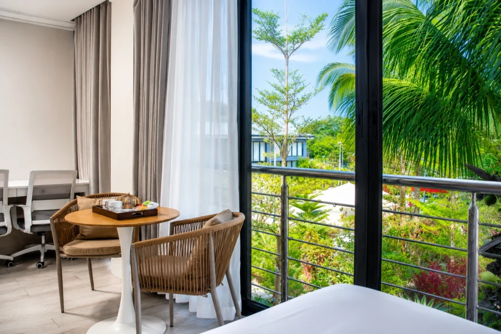 Modern hotel room near SkyRanch Tagaytay with balcony and relaxing garden view