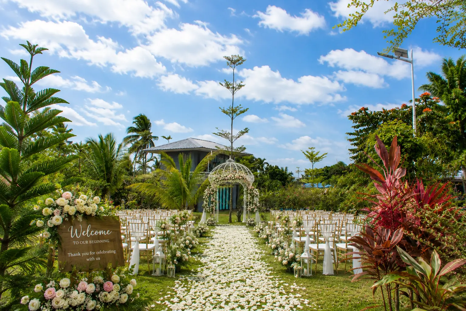 An elegant outdoor floral arrangement and guest seating setup for a beautiful garden wedding reception at Wondellea