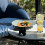 Wondellea Cafe Menu black ink seafood pasta paired with a citrus refresher