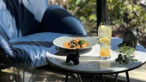 Wondellea Cafe Menu black ink seafood pasta paired with a citrus refresher