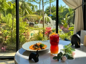Coffee, pastry, and iced drink by a garden view at the best coffee shop in Cavite