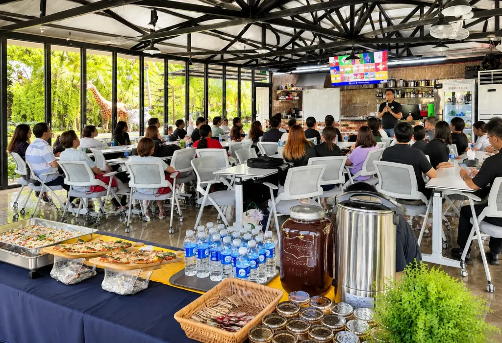 A corporate seminar and gathering held inside a spacious, glass-walled meeting room with catering at Wondellea